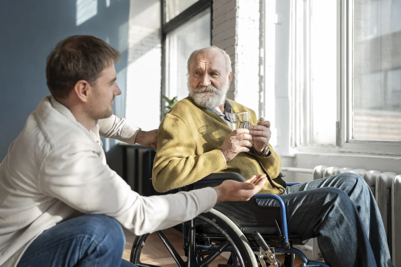Smiling care worker and elderly woman at home – real carers, real trust